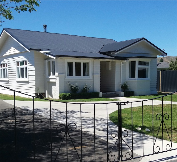 Completed long-run steel reroof on a weatherboard home